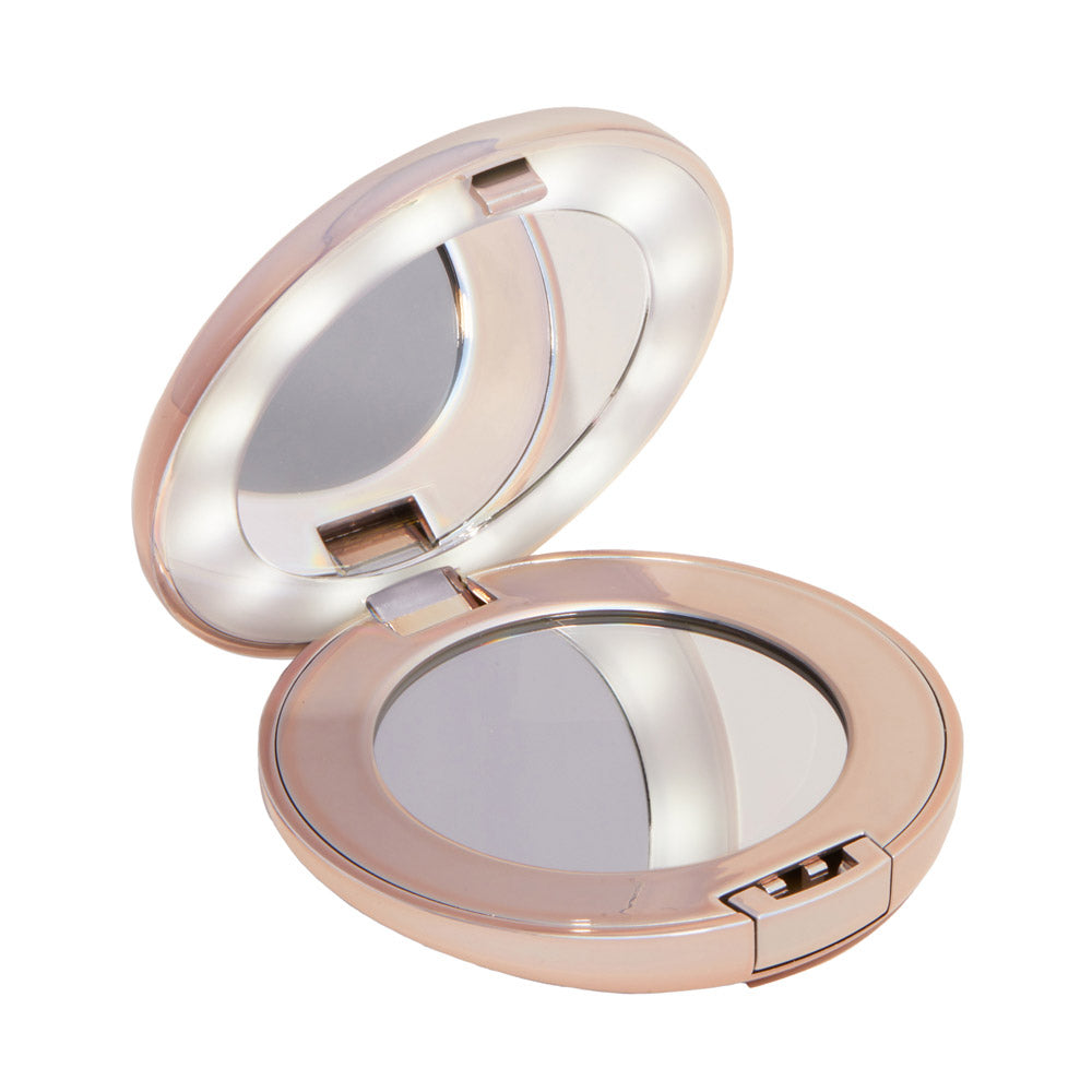 The glamnetic Compact Mirror in rose gold features two round mirrors—one with magnification—and a built-in LED light ring around the lid mirror for clear viewing.